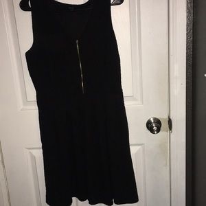 Black dress with a gold zipper